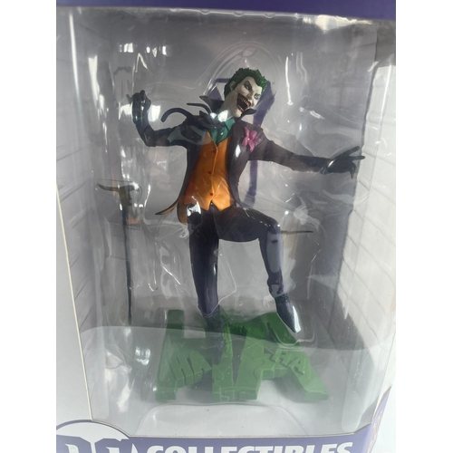 77 - A BOXED DC CORE COLLECTIBLES THE JOKER ON HA BASE COLLECTABLE VINYL PVC 10