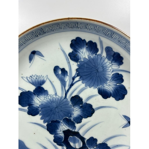 309A - A JAPANESE BLUE AND WHITE PORCELAIN FLORAL MEIJI PERIOD CHARGER PLATE, DIAMETER 29CM