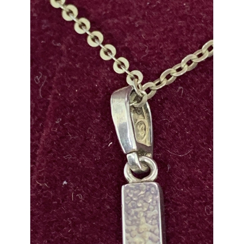 11 - A BOXED SILVER AMBER CROSS AND CHAIN