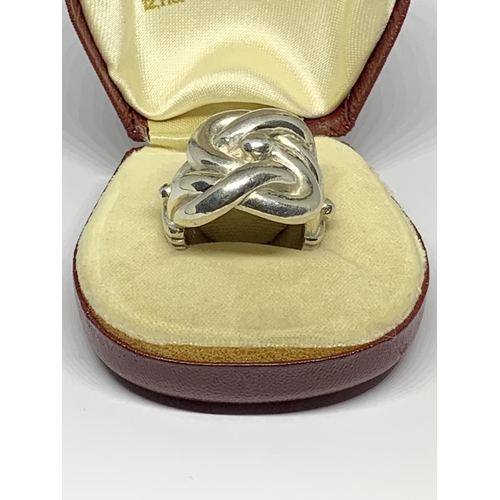 19 - A BOXED SILVER HEAVY KNOT RING