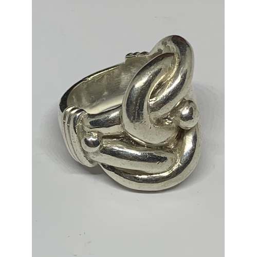 19 - A BOXED SILVER HEAVY KNOT RING