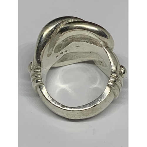 19 - A BOXED SILVER HEAVY KNOT RING