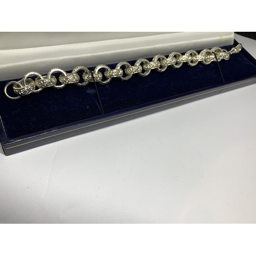 22 - A BOXED SILVER ROLLER BALL ORNATE BRACELET