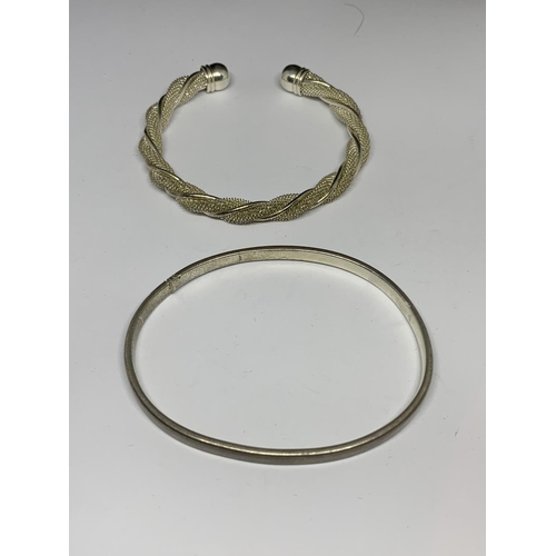 26 - TWO SILVER BANGLES