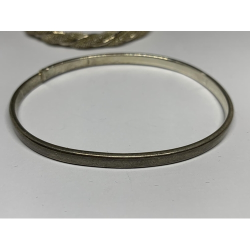 26 - TWO SILVER BANGLES