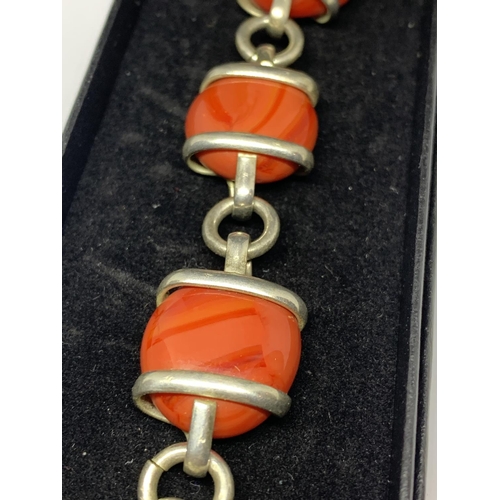 36 - A SILVER ORANGE STONE BRACELET