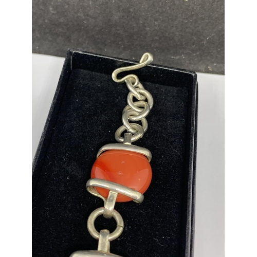 36 - A SILVER ORANGE STONE BRACELET