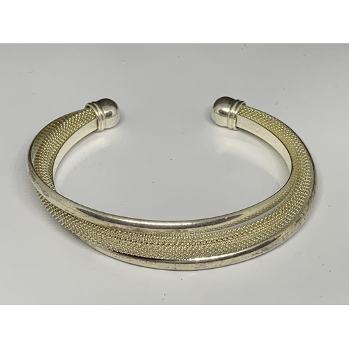 39 - TWO SILVER BANGLES