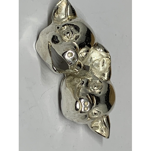 49 - A BOXED SILVER PIGS HEAD BROOCH