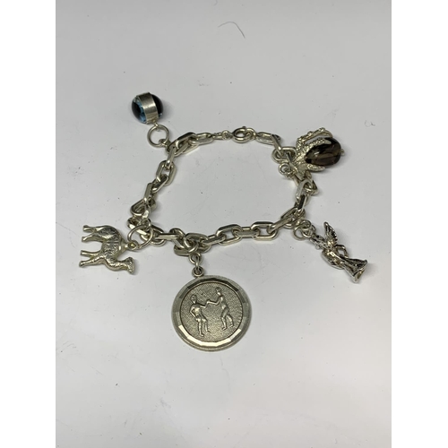 53 - TWO SILVER CHARM BRACELETS