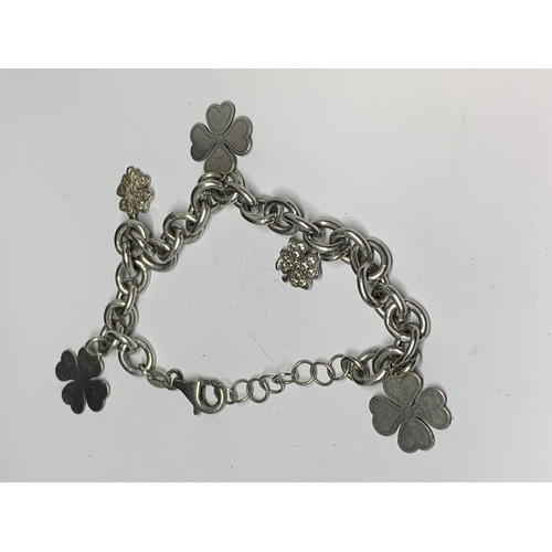 57 - TWO SILVER CHARM BRACELETS