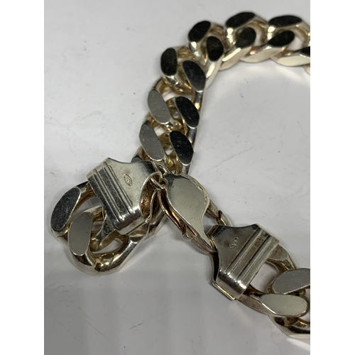 82 - A HEAVY SILVER WRIST CHAIN