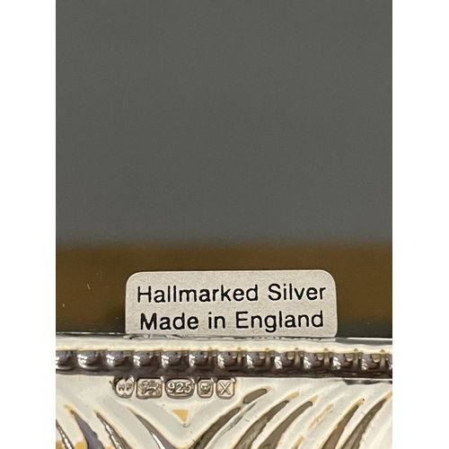 10 - A HALLMARKED SILVER PHOTOGRAPH FRAME