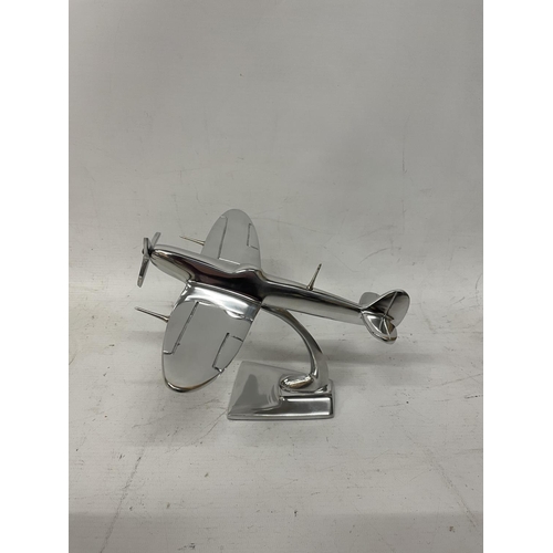 129 - A CHROME SPITFIRE MODEL ON A STAND