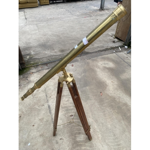 1503 - A VINTAGE BRASS TELESCOPE WITH WOODEN TRIPOD STAND