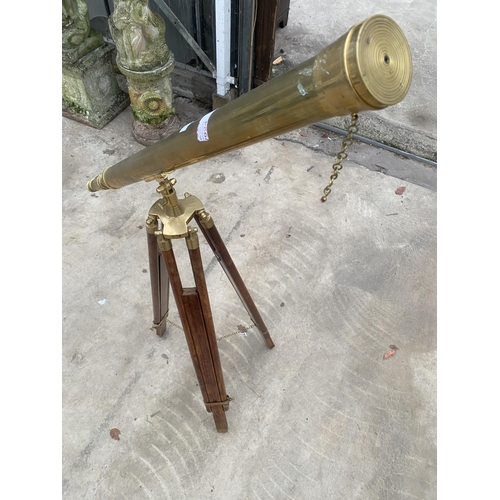 1503 - A VINTAGE BRASS TELESCOPE WITH WOODEN TRIPOD STAND