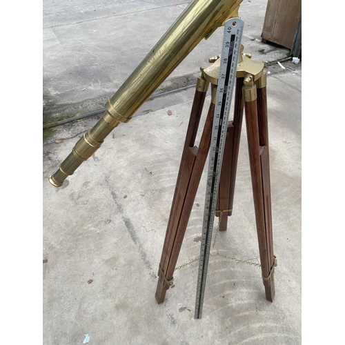 1503 - A VINTAGE BRASS TELESCOPE WITH WOODEN TRIPOD STAND