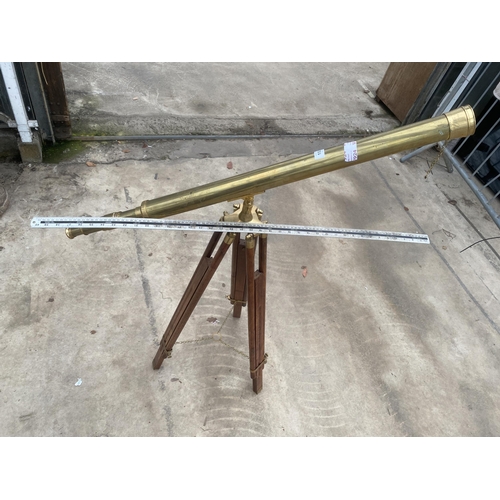 1503 - A VINTAGE BRASS TELESCOPE WITH WOODEN TRIPOD STAND