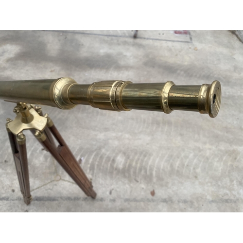 1503 - A VINTAGE BRASS TELESCOPE WITH WOODEN TRIPOD STAND