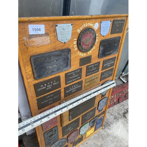 1506 - A WOODEN BOARD DISPLAYING A LARGE QUANTITY OF COMMEMERATIVE BRASS PLAQUES FROM VARIOUS STEAM RALLIES