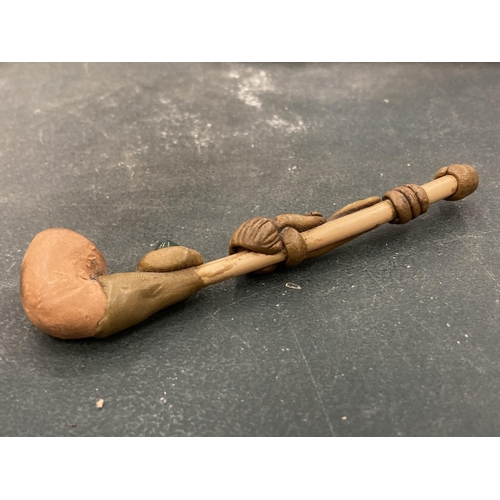 143 - A VINTAGE HANDMADE TRIBAL WOODEN PIPE