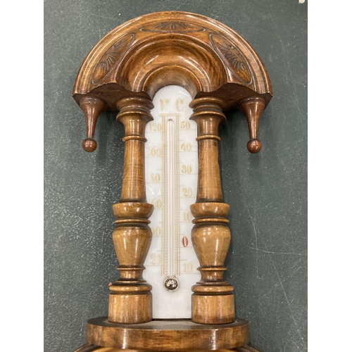 146 - AN ORNATE WALL BAROMETER