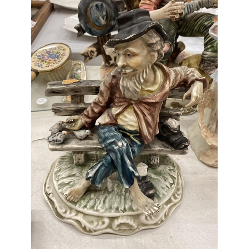 190 - A CAPODIMONTE MODEL OF A MAN AND CAT PLAYING THE ACCORDIAN, CAPODIMONTE STYLE MAN ON A BENCH - A/F A... 