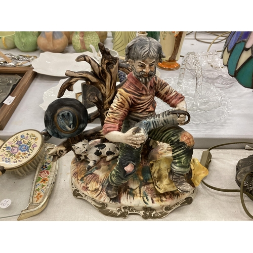 190 - A CAPODIMONTE MODEL OF A MAN AND CAT PLAYING THE ACCORDIAN, CAPODIMONTE STYLE MAN ON A BENCH - A/F A... 