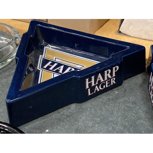 246 - TWO TRIANGULAR HARP LAGER ASHTRAYS