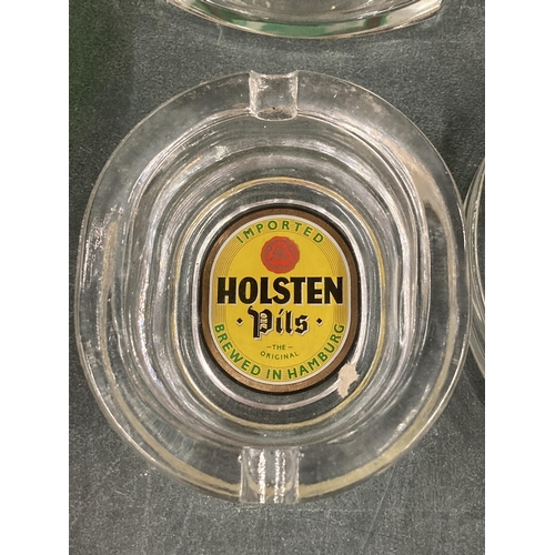 249 - FIVE GLASS ASHTRAYS TO INCLUDE HOLSTEN, PILSNER AND WARSTEINER