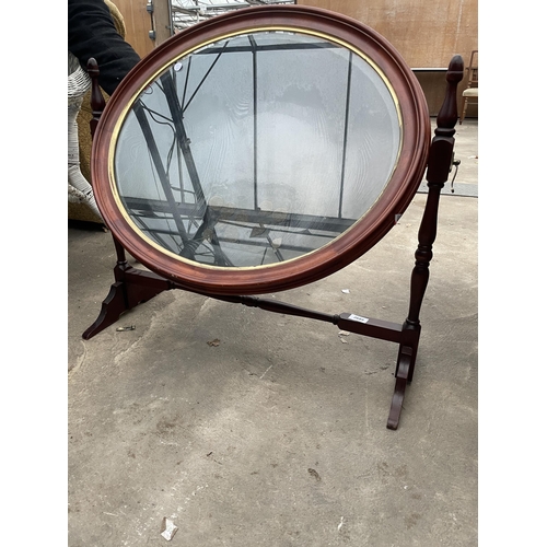 2689 - A MODERN OVAL SWING FRAME DISPLAY UNIT WITH TURNED UPRIGHTS