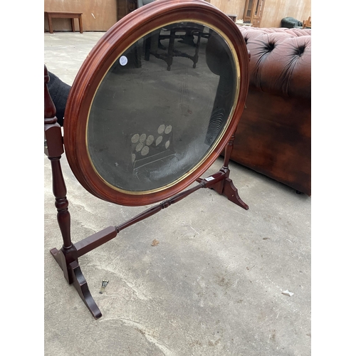 2689 - A MODERN OVAL SWING FRAME DISPLAY UNIT WITH TURNED UPRIGHTS