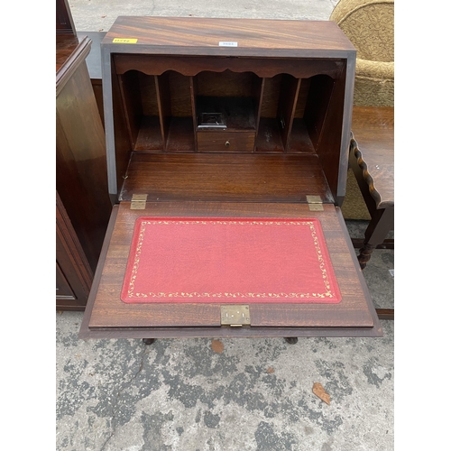 2693 - A MID 20TH CENTURY MAHOGANY BUREAU ON CABRIOLE LEGS, 21