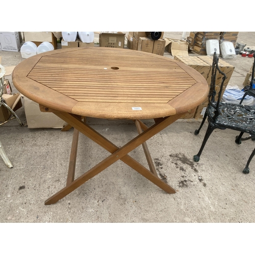 1663 - A ROUND TEAK FOLDING GARDEN TABLE