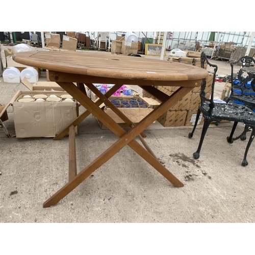 1663 - A ROUND TEAK FOLDING GARDEN TABLE