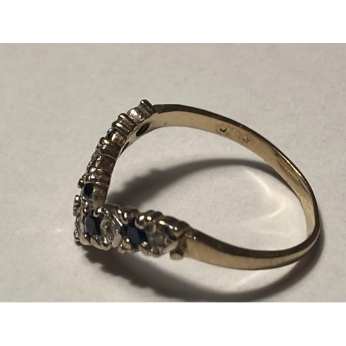 1 - A 9 CARAT GOLD WISHBONE RING WITH DIAMONDS AND SAPPHIRES