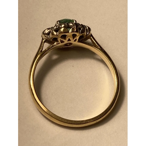 162 - AN 18 CARAT GOLD RING WITH CENTRE EMERALD SURROUNDED BY DIAMONDS SIZE M/N