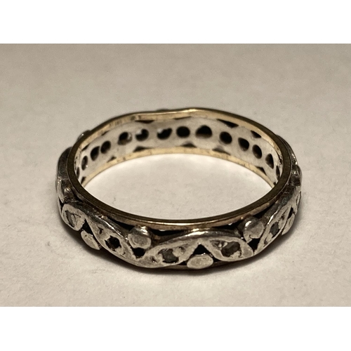 165 - A 9 CARAT GOLD AND SILVER ETERNITY RING SIZE L/M