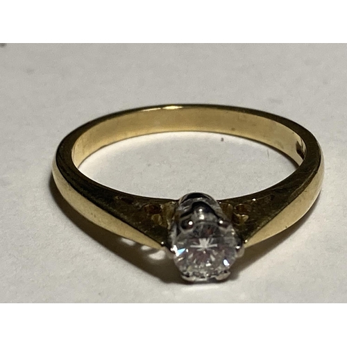 172 - AN 18 CARAT GOLD DIAMOND SOLITAIRE RING WITH PIERCED SHOULDERS SIZE L