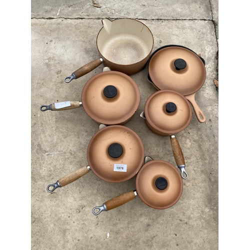 1976 - A SET OF SIX GRADUATED RETRO BROWN LE CREUSET PANS