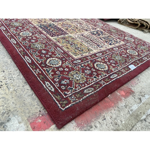 2486 - A SMALL RED PATTERNED RUG