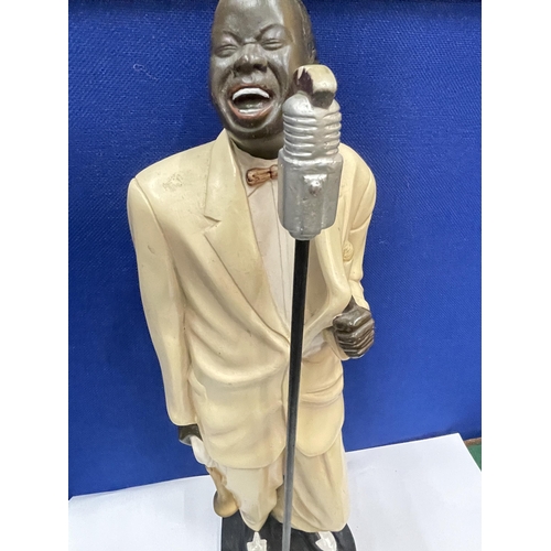 18 - A HEAVY LOUIS ARMSTRONG FIGURE WITH TRUMPET AND MICROPHONE 22 INCHES TALL