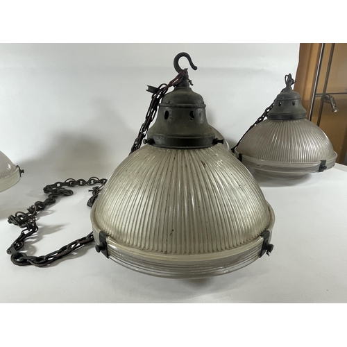 39 - A SET OF FOUR VINTAGE HOLOPHANE 5 LAMPS WITH METAL FITTINGS AND CHAIN