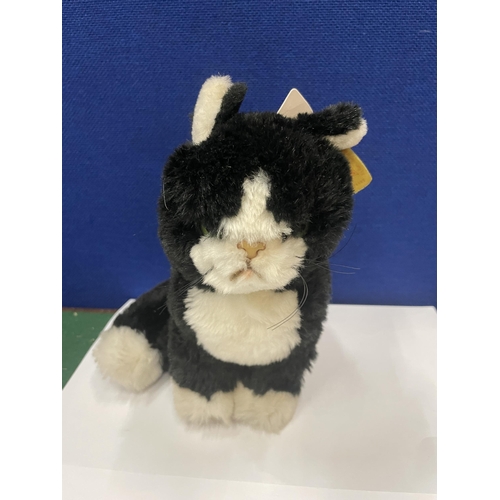 41 - A VINTAGE STEIFF BLACK AND WHITE CAT WITH EAR TAG BUTTON