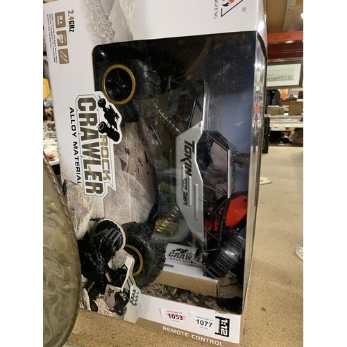 A ROCK CRAWLER REMOTE CONTROL CAR (NEW IN BOX) INCLUDES BATTERIES
