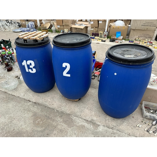 2052 - THREE LIDDED PLASTIC DRUMS TWO WITH TROLLEY BASES