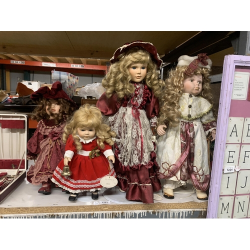 1241 - A GROUP OF ASSORTED DOLLS ON STANDS ETC