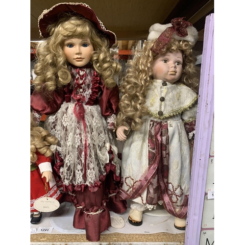 1241 - A GROUP OF ASSORTED DOLLS ON STANDS ETC