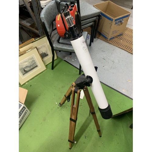 1245 - A STUDENTS TELESCOPE ON WOODEN TRIPOD BASE