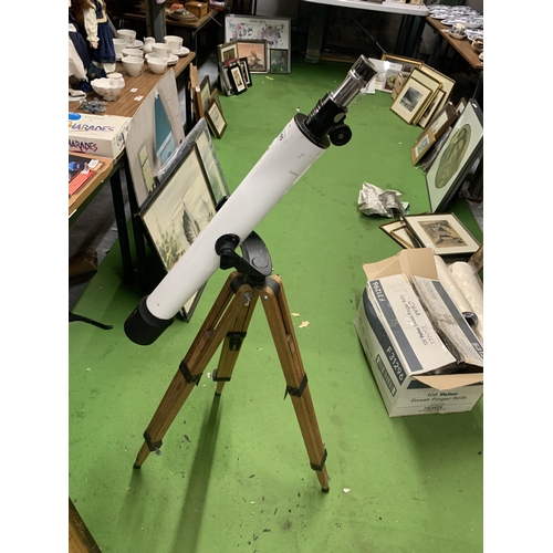 1245 - A STUDENTS TELESCOPE ON WOODEN TRIPOD BASE